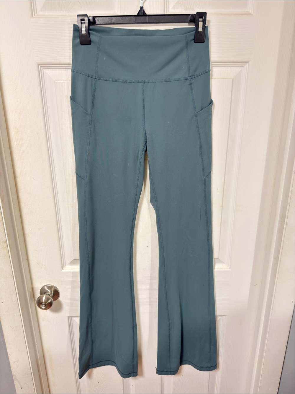 Fabletics Teal High-Rise Flare Leggings with Side Pockets